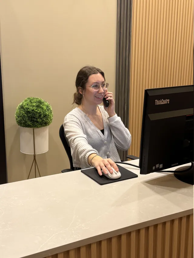 My New Teeth receptionist helping a patient by phone