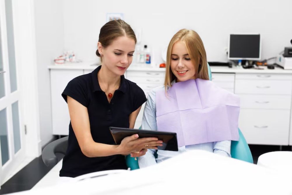 dentist discussing a smile makeover treatment plan with a patient